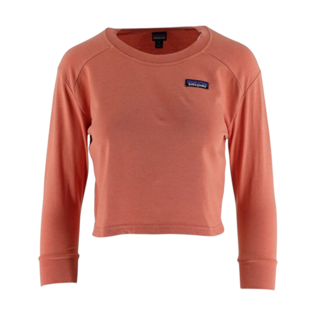 Coral long-sleeve shirt with a brand logo on a white background