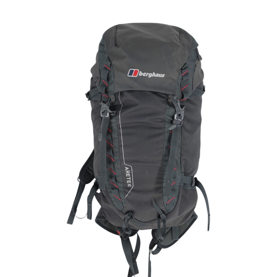 A dark gray Berghaus hiking backpack with red stitching accents and white logo branding on the front, shown against a plain white background.