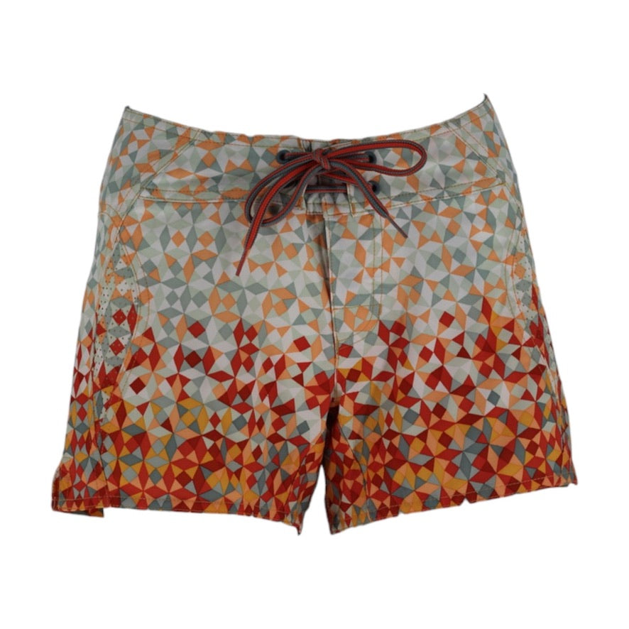 Colorful geometric patterned shorts on a white background