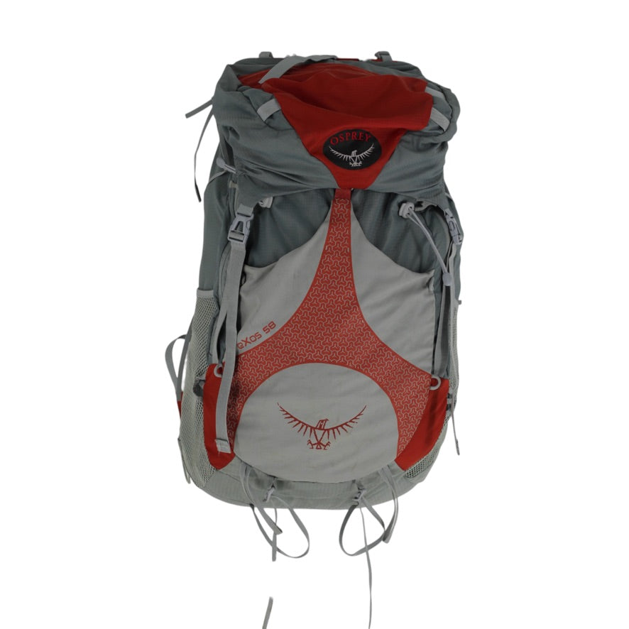 An Osprey backpack in gray and red, featuring the brand's logo on the front pocket and top flap, set against a plain white background.
