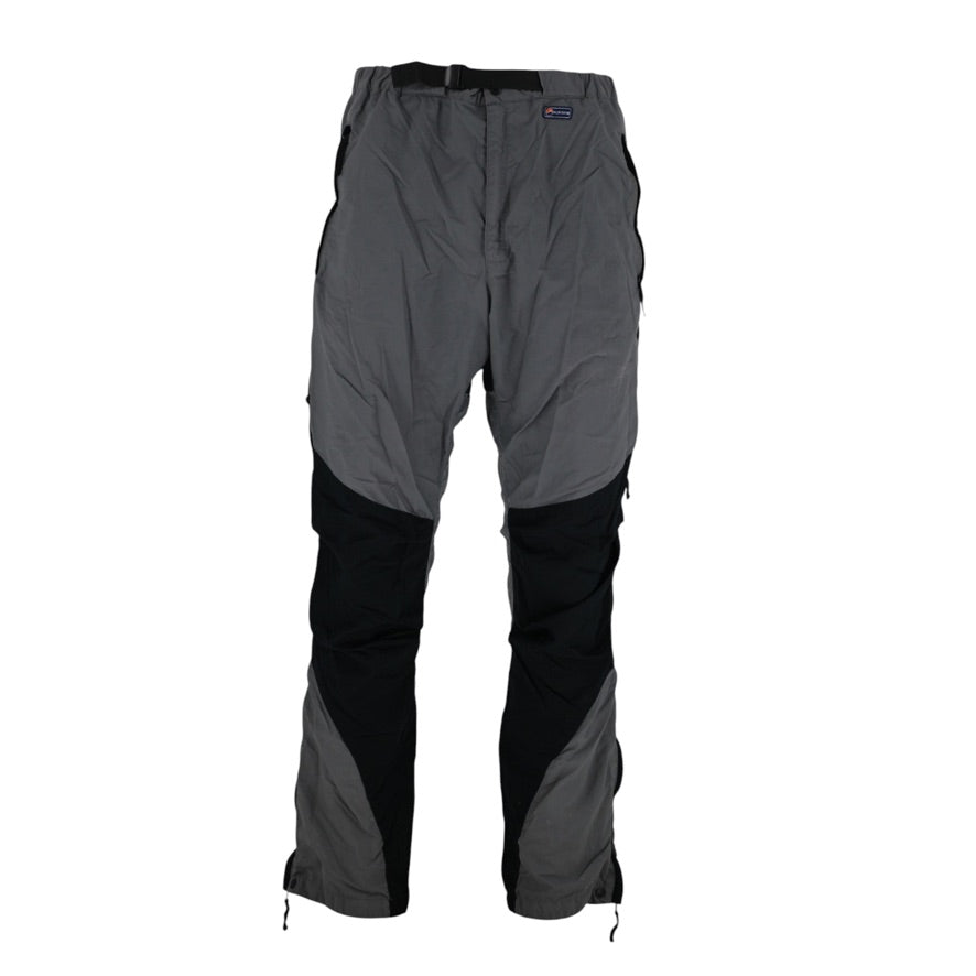 A pair of outdoor technical pants in gray and black, shown flat against a solid white background.