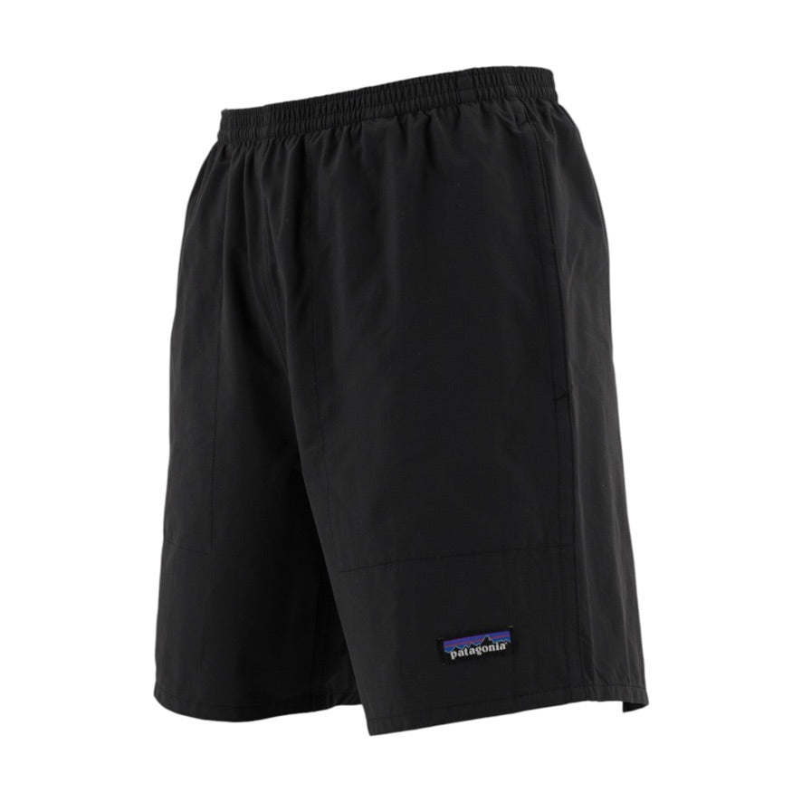 Black Patagonia athletic shorts with an elastic waistband and a small Patagonia logo patch near the lower left hem, shown against a plain white background.