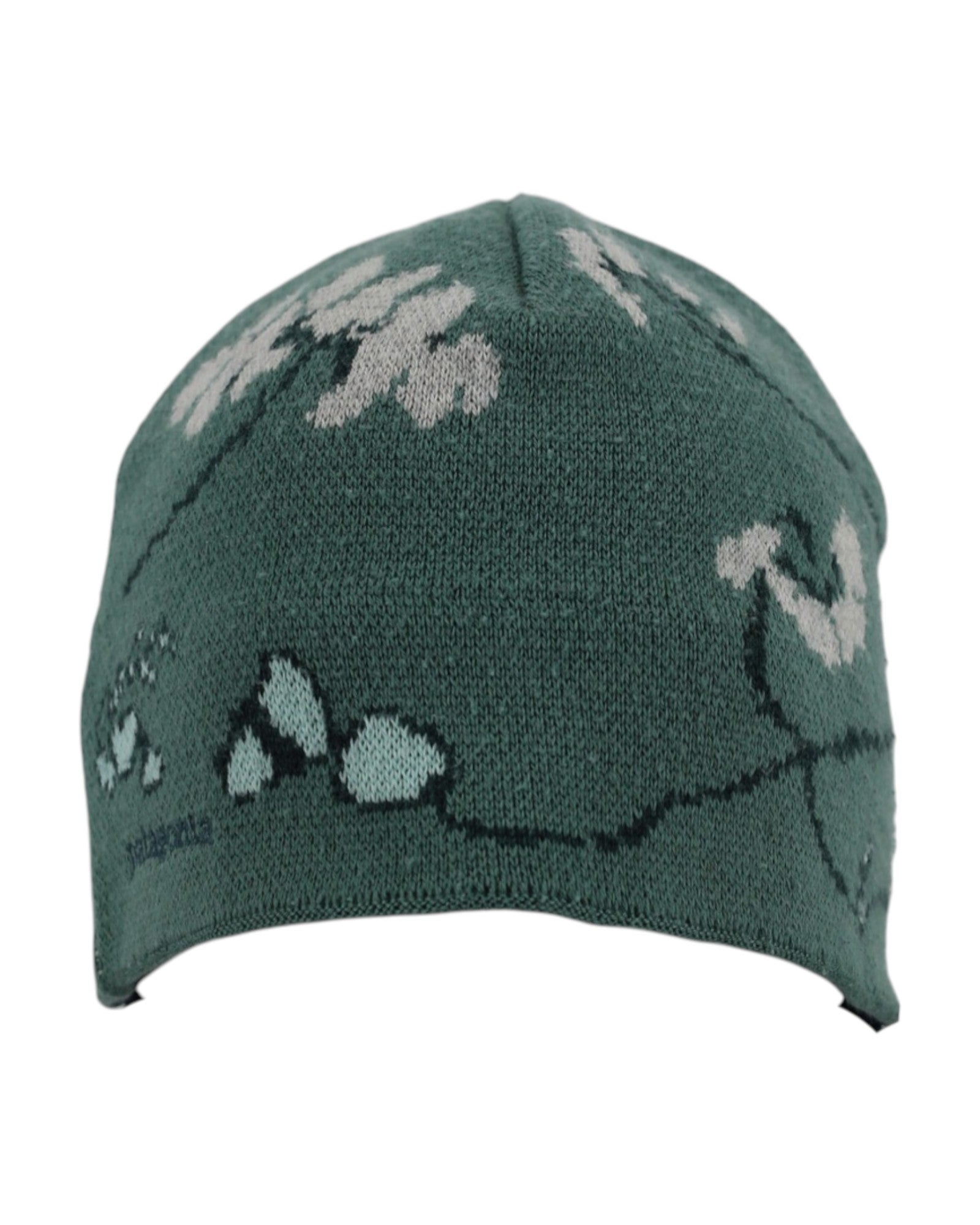 Green knit beanie with white floral patterns on a white background