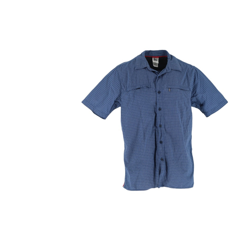 A short-sleeve button-up shirt with a blue and white micro-check pattern, featuring two chest pockets and a pointed collar, shown against a plain white background.